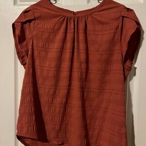 Salmon colored short sleeve top